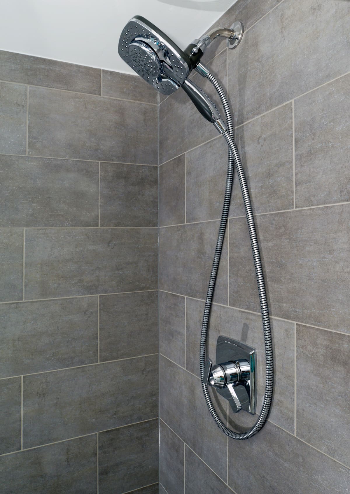 Gray Stone Walk-In Shower Bathroom — Karma Construction Group