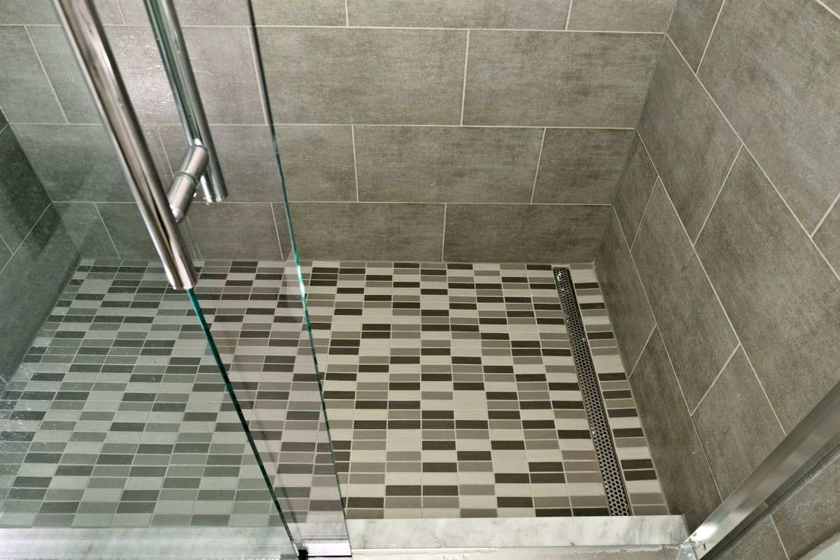 Gray Stone Walk-In Shower Bathroom — Karma Construction Group