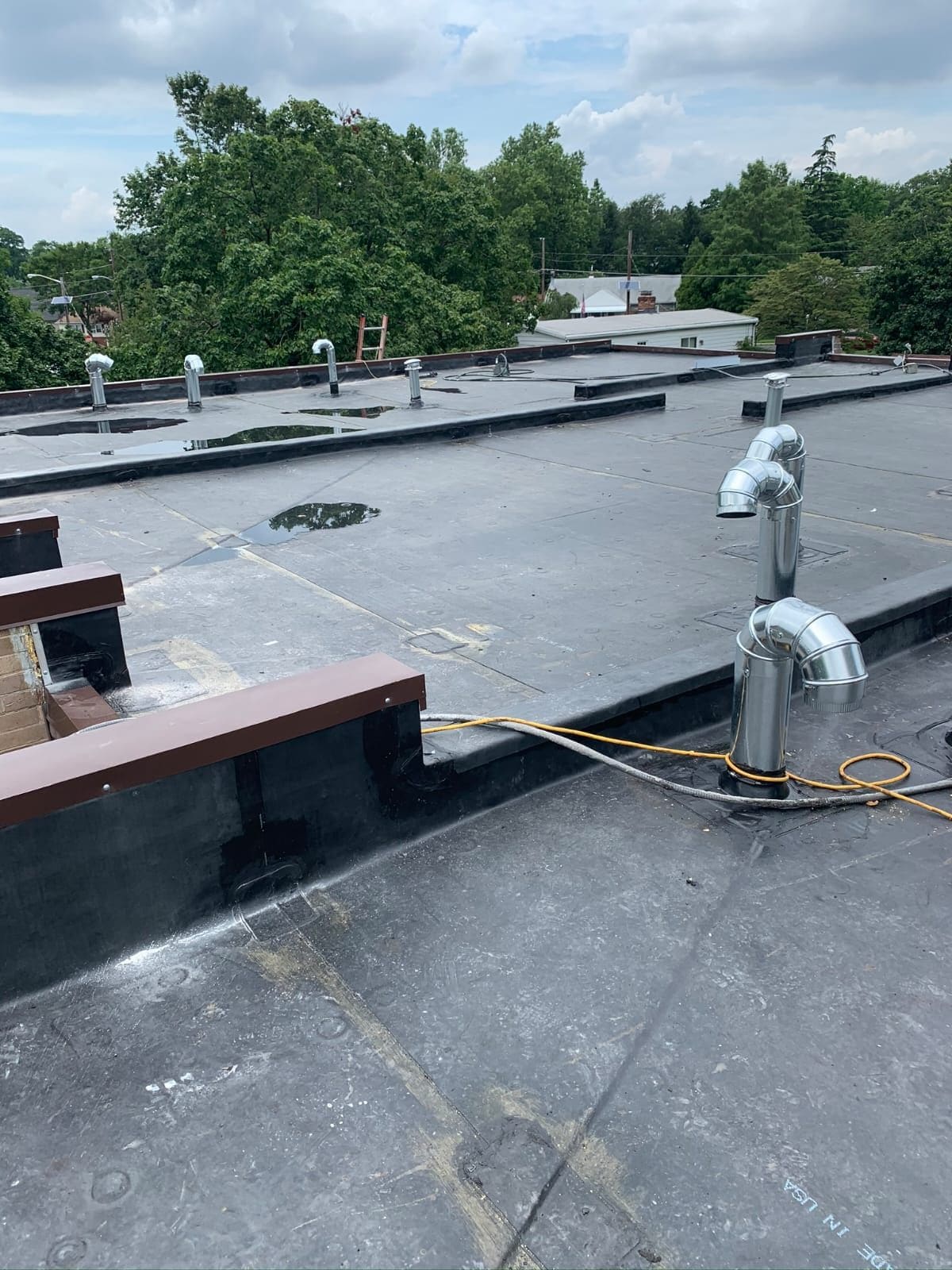 Roofing in Action — DMV, Raleigh & Miami — Karma Construction Group